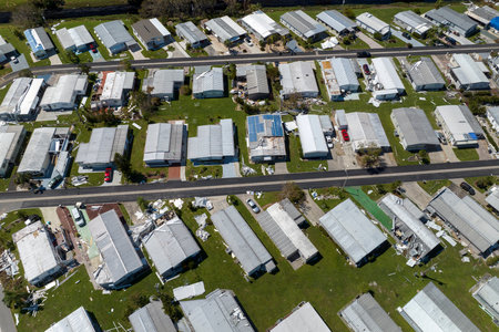 View from above of destroyed by hurricane Ian suburban houses in Florida mobile home residential area. Consequences of natural disasterの写真素材