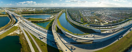 American big freeway intersection in Miami, Florida with fast moving cars and trucks. USA...