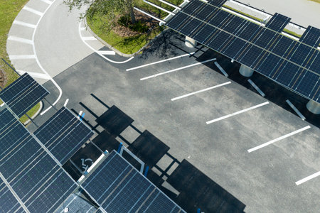 Wind damage to solar panels installed over parking lot canopy shade for parked cars for effective...