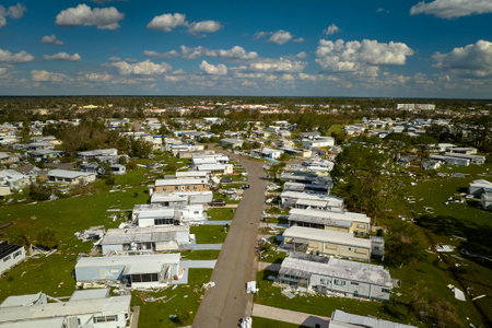 Destroyed by hurricane Ian suburban houses in Florida mobile home residential area. Consequences of...