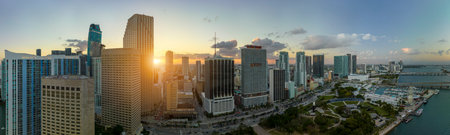 View from above of high skyscraper buildings in downtown district of Miami Brickell in Florida, USA at sunset. American megapolis with business financial district at nightfallの写真素材