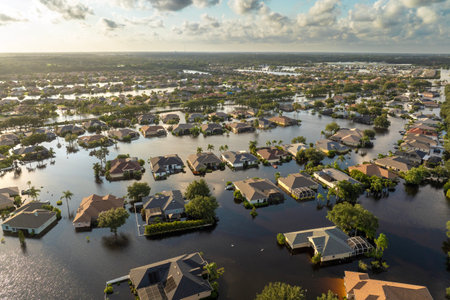 Flooded houses from hurricane rainfall water in Florida residential community. Aftermath of natural disaster in USA southの写真素材