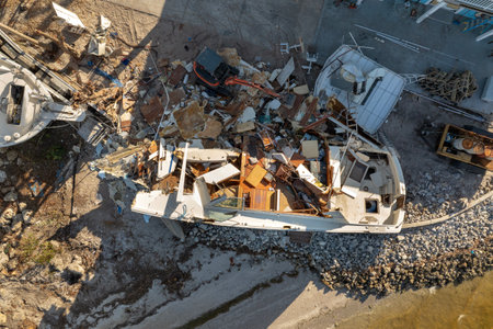 Destroyed yachts capsized on shore after hurricane Milton in Englewood, Florida