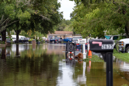 Hurricane flooded street with mail box surrounded with water in Florida residential area. Consequences of natural disasterの写真素材