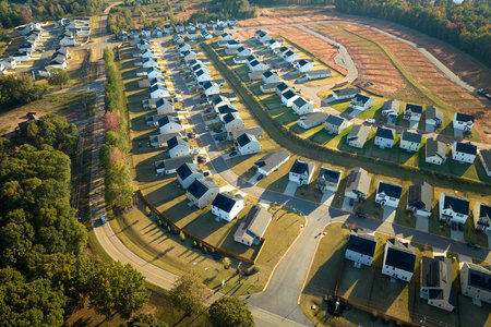 Aerial view of tightly packed homes in South Carolina residential area. New family houses as example...