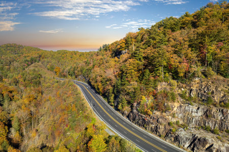 American highway in North Carolina Appalachian mountains in fall season with fast moving traffic. Interstate transportation conceptの写真素材