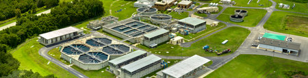 Aerial view of modern water cleaning facility at urban wastewater treatment plant. Purification process of removing undesirable chemicals, suspended solids and gases from contaminated liquidの写真素材