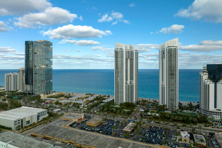 Aerial view of Sunny Isles Beach city with luxurious highrise hotels and condos on Atlantic ocean shore. American tourism infrastructure in southern Floridaの写真素材