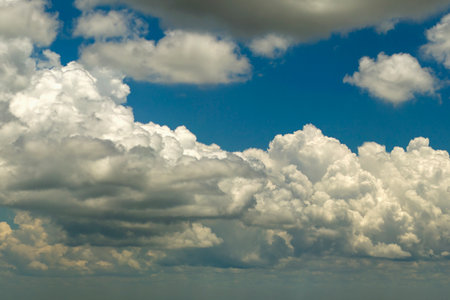 Blue sky with white clouds. Bright summer skyscapeの写真素材