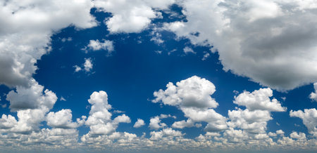 Blue sky with white summer rain clouds. Colorful summer landscapeの写真素材