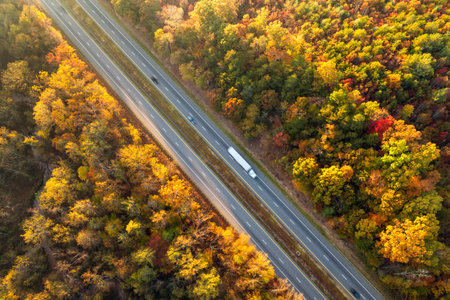 Highway road in North Carolina Appalachian mountains in fall season. Expressway lanes for fast passing of car trafficの写真素材