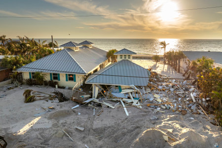 Ruined buildings in need of demolition or repair. Storm surge water and wind damaged houses roof and collapsed walls after hurricane in Floridaの写真素材
