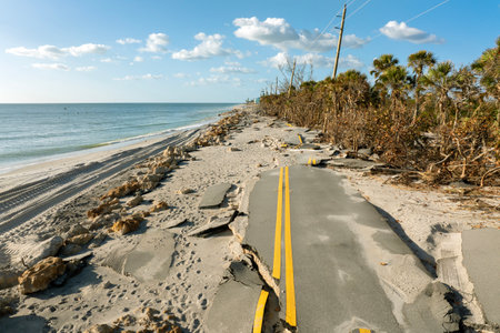 Storm surge destroyed oceanfront road on Gulf coast after hurricane in Florida. Severe damage to transportation infrastructureの写真素材