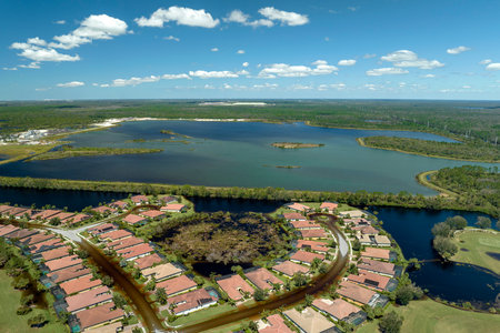 Surrounded by hurricane Ian rainfall flood waters homes in Florida residential area. Aftermath of natural disasterの写真素材
