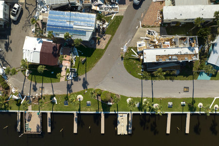 Strong hurricane winds severely damaged private houses in Florida mobile home residential area. Consequences of natural disasterの写真素材