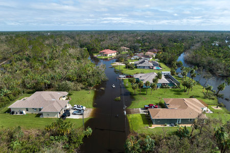 Aftermath of natural disaster. Flooded houses by hurricane Ian rainfall in Florida residential areaの写真素材