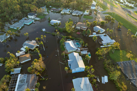 Flooded houses by hurricane Ian rainfall in Florida residential area. Consequences of natural disasterの写真素材