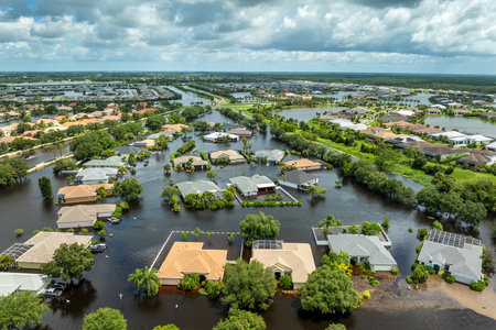 Flooded houses from hurricane rainfall water in Florida residential community. Aftermath of natural disaster in USA southの写真素材