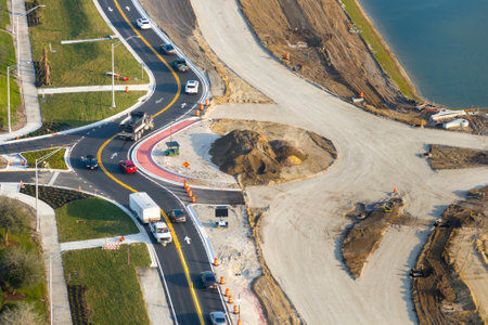 Industrial roadworks. Roundabout on wide American highway under construction. Development of transportation system for rapid transitの写真素材