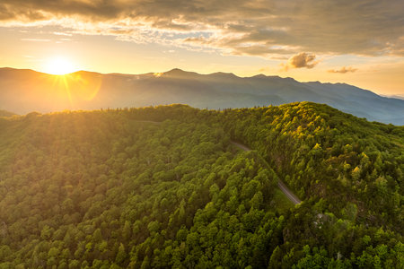 Mountain pass road in North Carolina Appalachian mountains, USA. Blue Ridge Parkway in summer season at sunsetの写真素材