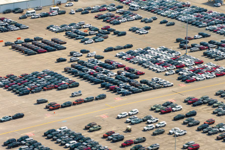 New cars parked for sale on automotive factory parking lot. Dealer vehicle inventory for import and export business commercial worldwideの写真素材
