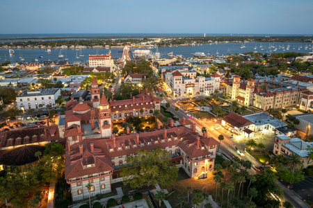 Old town America architecture. Aerial view of Flagler College campus in St. Augustine city in Florida at nightの写真素材