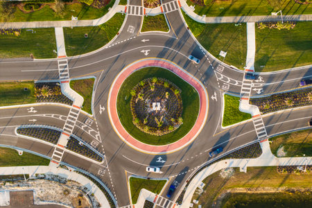 Roundabout road with car traffic. Crossing of highways by ring intersectionの写真素材
