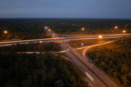 USA highway transportation infrastructure. American freeway junction with fast driving carsの写真素材