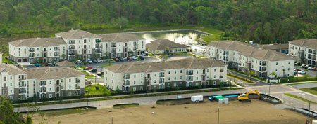 Aerial view of american apartment buildings in Florida residential area. New family condos as example of housing development in US suburbsの写真素材