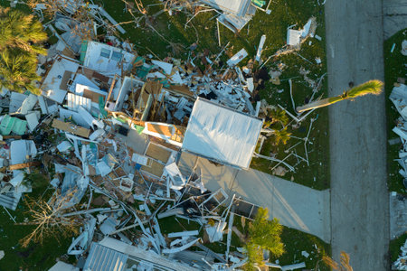 Badly damaged mobile homes after hurricane Ian in Florida residential area. Consequences of natural...