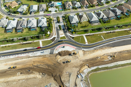 Industrial roadworks. Roundabout on wide American highway under construction. Development of transportation system for rapid transitの写真素材