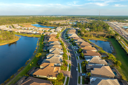 Large residential homes in southwest Florida gated community. American houses in rural US suburbsの写真素材