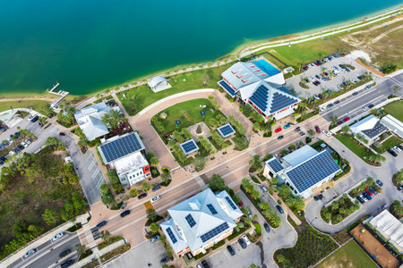 Photovoltaic panels on solar rooftops of Florida commercial buildings for producing clean ecological electrical energy. Renewable electricity with zero emission conceptの写真素材