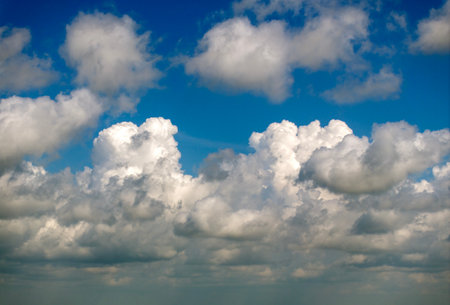 Rain clouds forming on blue sky. Colorful summer skyscapeの写真素材