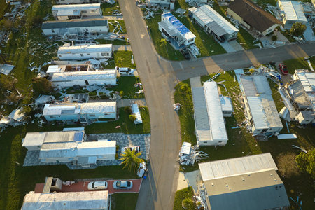 Severely damaged by hurricane Ian houses in Florida mobile home residential area. Consequences of natural disasterの写真素材