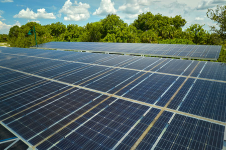 Solar panels installed over parking lot for parked cars for effective generation of clean energyの写真素材