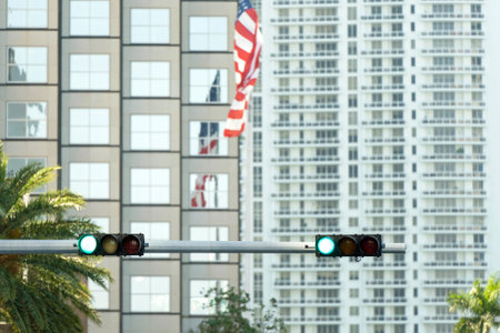 Traffic lights for traffic regulation high above street in Miami, Floridaの写真素材