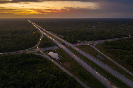 USA highway transportation infrastructure. American freeway junction with fast driving carsの写真素材