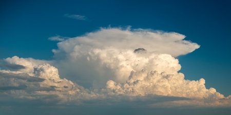 Blue sky with white summer rain clouds. Colorful summer landscapeの写真素材