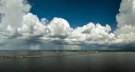 Barron Collier Bridge and Gilchrist Bridge in Florida with moving traffic. Transportation infrastructure in Charlotte County connecting Punta Gorda and Port Charlotte over Peace Riverの写真素材