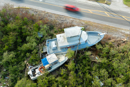 Capsized yachts left forsaken on shore after hurricane Milton on Manasota Key in Englewood, Florida