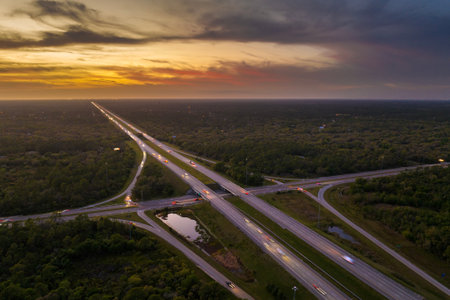 Freeway overpass junction in Florida with fast moving traffic cars and trucks in American rural area...