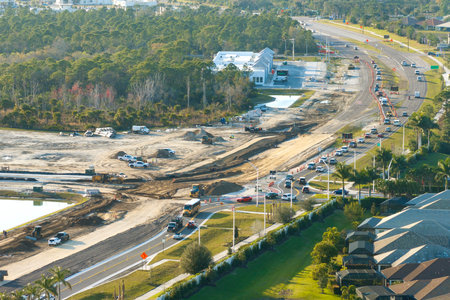 Industrial roadworks. Wide American highway under construction. Development of transportation system for rapid transitの写真素材