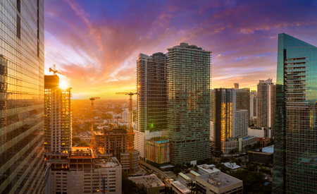 Miami, Florida. New construction site of developing residence in American urban area at sunset. Concept of housing growth in the USAの写真素材