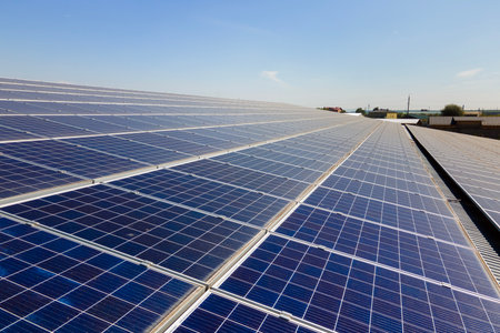 Solar photovoltaic panels installed on building roof for producing clean ecological electric energy....