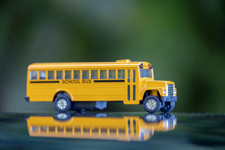 Toy american yellow school bus as symbol of education in the USAの写真素材