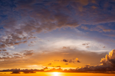 Amazing evening skyscape. Sunset sky with bright colorful cloudsの写真素材