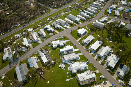 Badly damaged mobile homes after hurricane Ian in Florida residential area. Consequences of natural disasterの写真素材
