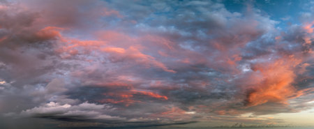 Beautiful sunset sky scenery. Bright colorful orange and yellow clouds on horizonの写真素材