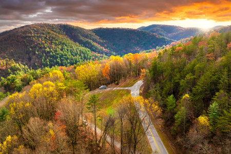 Blue Ridge Parkway in full autumn splendor. North Carolina mountain highway lined with brilliant red, orange, and gold foliageの写真素材